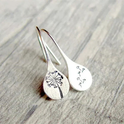 Pendientes de hoja de diente de león de plata finamente elaborados